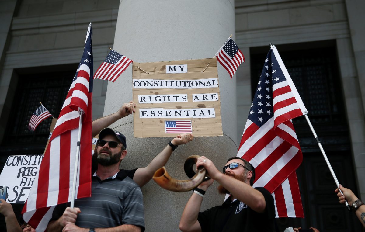 Demonstrators protest against an extended stay-at-home order to help slow the spread of COVID-19 at the Capitol building in Olympia, Washington, on April 19, 2020. (Lindsey Wasson/Reuters)