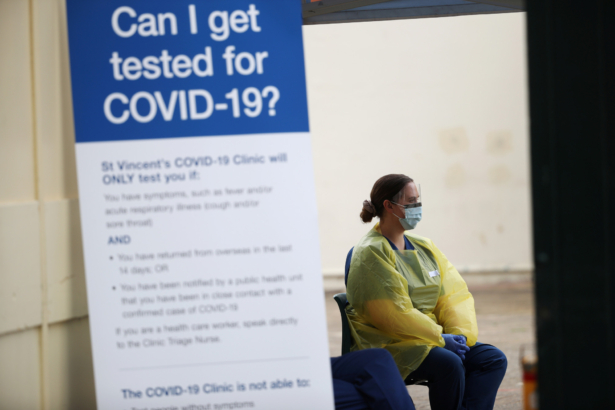 A healthcare professional waits at a pop-up clinic testing for the coronavirus disease (COVID-19) at Bondi Beach, after several outbreaks were recorded in the area, in Sydney, Australia, on April 1, 2020. (Loren Elliot/Reuters)