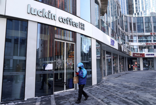 A deliveryman walks past a closed Luckin Coffee store at Sanlitun, as the country is hit by an outbreak of the new coronavirus, in Beijing, China on Feb. 7, 2020. (Jason Lee/Reuters)
