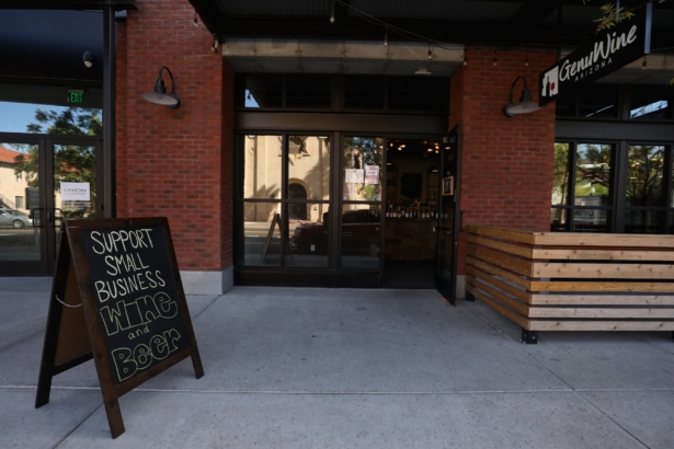 A sign reading "Support Small Business" is displayed outside of GenuWine Arizona restaurant in Phoenix, Ariz., on March 26, 2020. (Christian Petersen/Getty Images)