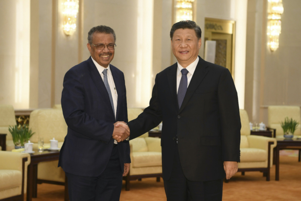 World Health Organization director-general Tedros Adhanom (L) shakes hands with Chinese regime leader Xi Jinping before a meeting at the Great Hall of the People in Beijing, China, on Jan. 28, 2020. (Naohiko Hatta/AFP via Getty Images)