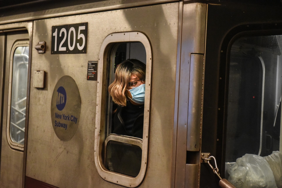 A train conductor wears a protective mask while riding on a subway through the Fulton St. station in Manhattan in New York City, on May 6, 2020. (Stephanie Keith/Getty Images)