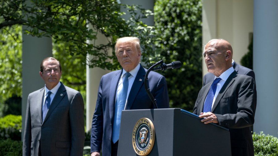 Vaccine Adviser Resigns at Biden's Request