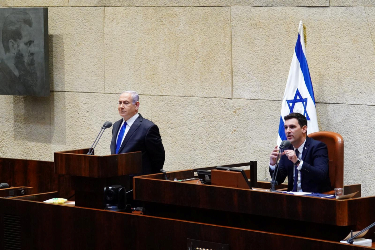 Israeli Prime Minister Benjamin Netanyahu speaks during a swearing in ceremony of his new unity government with election rival Benny Gantz, at the Knesset, Israel's parliament, in Jerusalem, on May 17, 2020. (Adina Valman/Knesset spokespersons' office/Handout via Reuters)