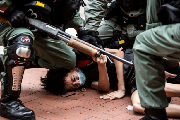 Pro-democracy protesters are arrested by police in the Causeway Bay district of Hong Kong, ahead of planned protests against a proposal to enact new security legislation in Hong Kong, on May 24, 2020. (Isaac Lawrence/AFP/Getty Images)