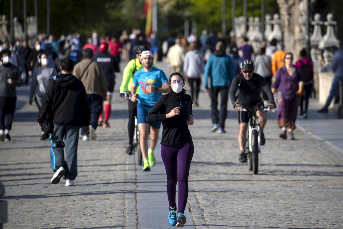 People cross the Toledo bridge in Madrid, Spain, on May 3, 2020. (Manu Fernandez/AP Photo)