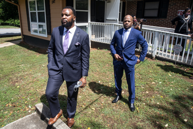 Lee Merritt, left, and Chris Stewart, attorneys for the mother of Ahmaud Arbery, are seen at a news conference on Wednesday, May 19, 2020, in East Point, Georgia. (Photo by Ron Harris/AP)