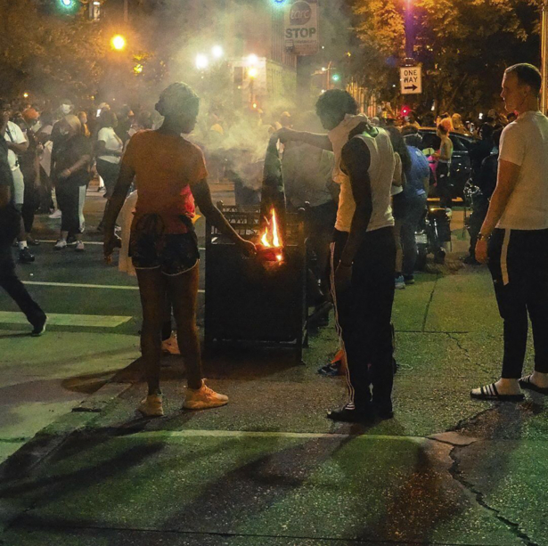 Demonstrators gather to protest the killing of Breonna Taylor, a black woman fatally shot by police in her home in March, downtown Louisville, in Ky., on May 28, 2020. (@mckinley_moore via AP)