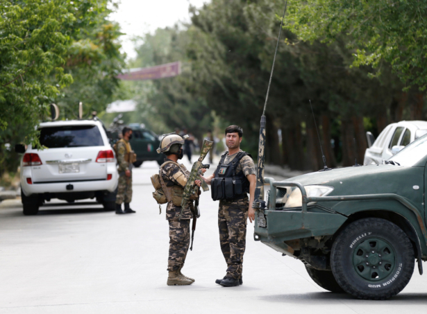 Afghan security forces stand guard near the site of an attack in Kabul, Afghanistan, on June 12, 2020. (Mohammad Ismail/Reuters)