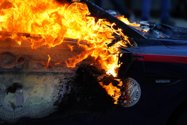 A burning police car is seen during a protest over the Minneapolis death of George Floyd while in police custody in Atlanta, Georgia, on May 29, 2020. (Elijah Nouvelage/Getty Images)