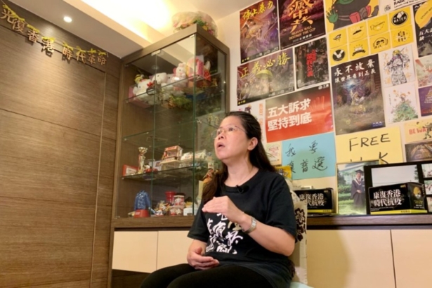 Office worker Daisy Lam speaks to Reuters about her experience in joining the annual June 4 candlelight vigil, at her living room in Hong Kong, China, on June 1, 2020. (Yoyo Chow/Reuters)