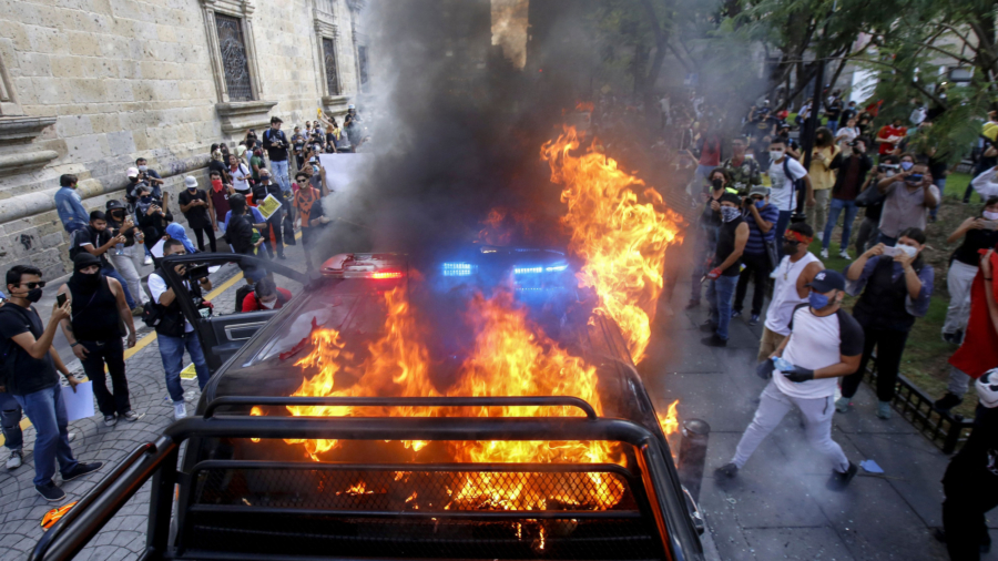Shocking Video Shows Mexican Police Officer Set Ablaze by Rioter During Protest