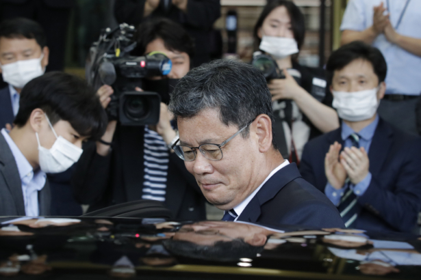 South Korean Unification Minister Kim Yeon-chul gets into a car as he leaves the government complex in Seoul, South Korea, on June 19, 2020. (Lee Jin-man/AP Photo)