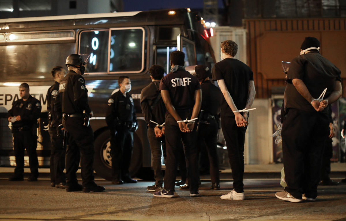 Men are arrested after curfew went into effect during demonstrations over George Floyd’s death downtown in Los Angeles, Calif., on June 2, 2020. (Mario Tama/Getty Images)