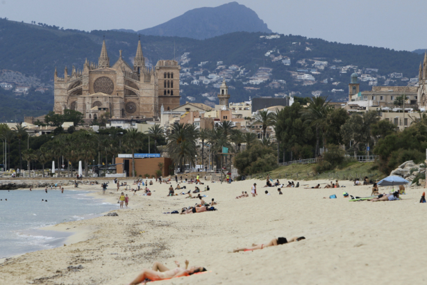 People visit the beach in Palma de Mallorca, Spain, on May 25, 2020. (Isaac Buj/Europa Press via AP)
