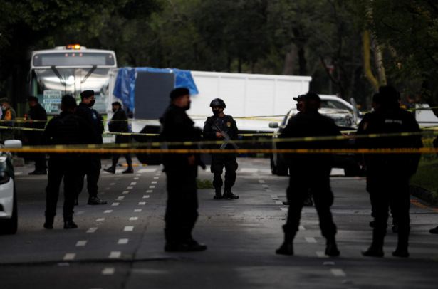Police stand guard at a crime scene where the chief of police was attacked by gunmen in the early morning hours, in Mexico City, on June 26, 2020. (Rebecca Blackwell/AP Photo)