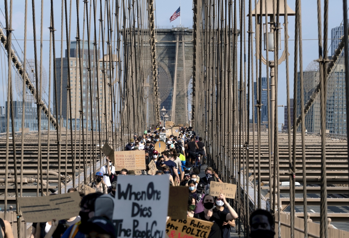 Protesters and activists walk across the Brooklyn Bridge in New York City on June 6, 2020. (Craig Ruttle/AP Photo)