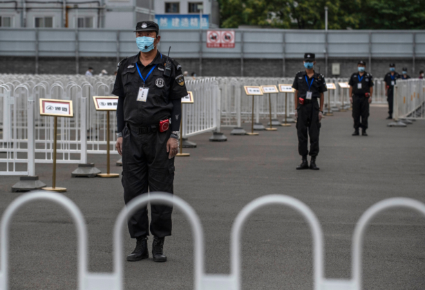 Chinese security are seen at a nucleic acid swab test government site for COVID-19 in Xicheng District during an organized tour in Beijing, China, on June 24, 2020. (Kevin Frayer/Getty Images)