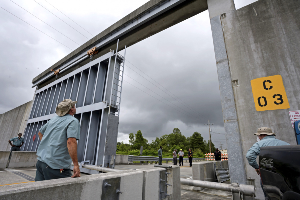 Crews from the Southeast Louisiana Flood Protection Authority East close the Bayou Road flood gate in St. Bernard Parish, La., on June 6, 2020, ahead of tropical storm Cristobal. (Max Becherer/The Times-Picayune/The New Orleans Advocate)