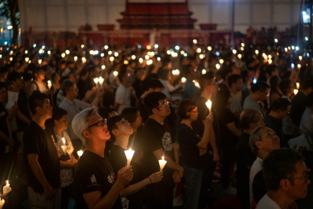 People hold candles as they take part in a candlelight vigil at Victoria Park in Hong Kong, China, on June 4, 2019. (Anthony Kwan/Getty Images)