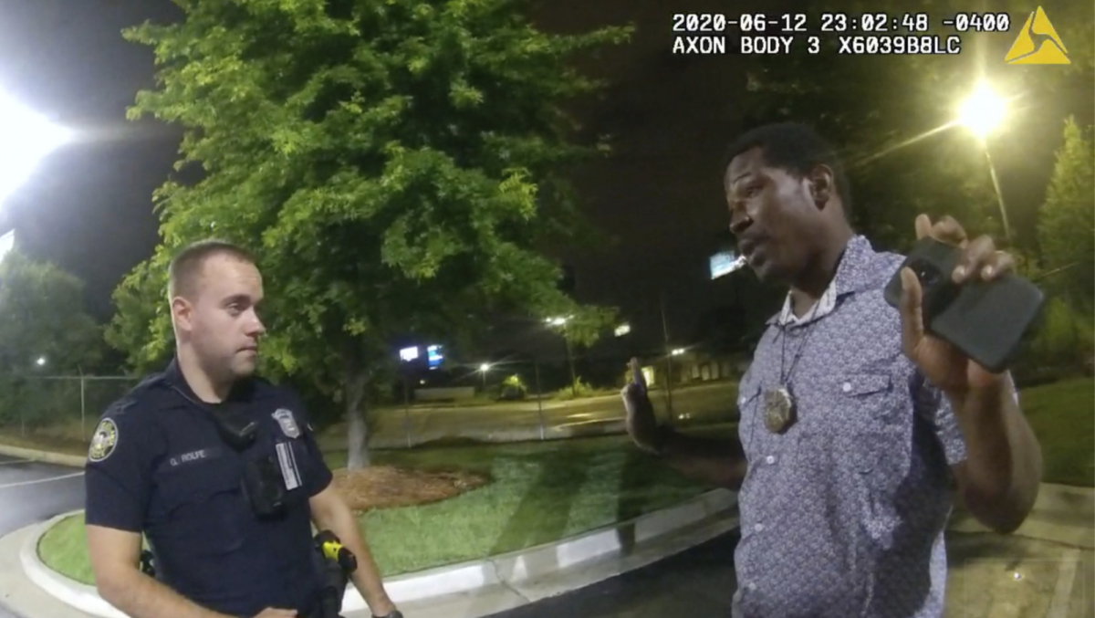 This screen grab taken from body camera video provided by the Atlanta Police Department shows Rayshard Brooks speaking with Officer Garrett Rolfe in the parking lot of a Wendy's restaurant, in Atlanta, Ga., late on June 12, 2020. (Atlanta Police Department via AP)