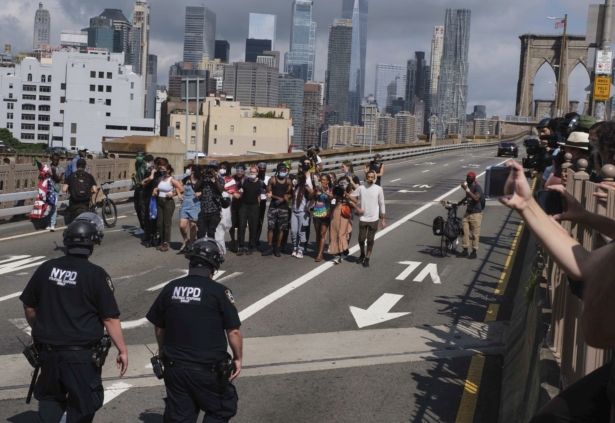 NYPD stand on the Brooklyn Bridge as Black Lives Matter protests on July 15, 2020, in New York. (AP Photo/Yuki Iwamura)