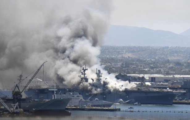 Smoke rises from the USS Bonhomme Richard at Naval Base San Diego after an explosion and fire on board the ship, in San Diego, Calif.,  on July 12, 2020. (Denis Poroy/AP Photo)