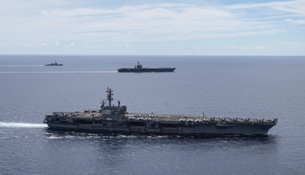The USS Ronald Reagan (CVN 76, front) and USS Nimitz (CVN 68, rear) Carrier Strike Groups sail together in formation, in the South China Sea, on July 6, 2020. (Mass Communication Specialist 3rd Class Jason Tarleton/U.S. Navy via AP)