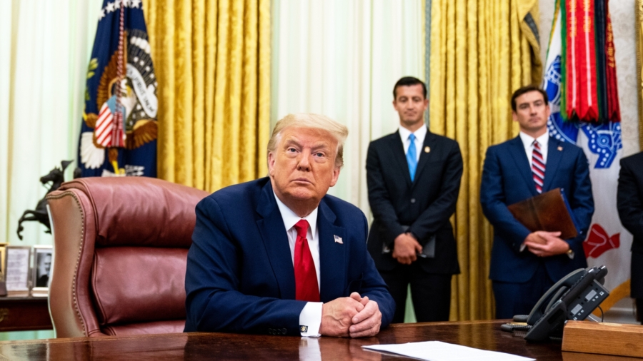 Trump Signs Law to Sanction Beijing