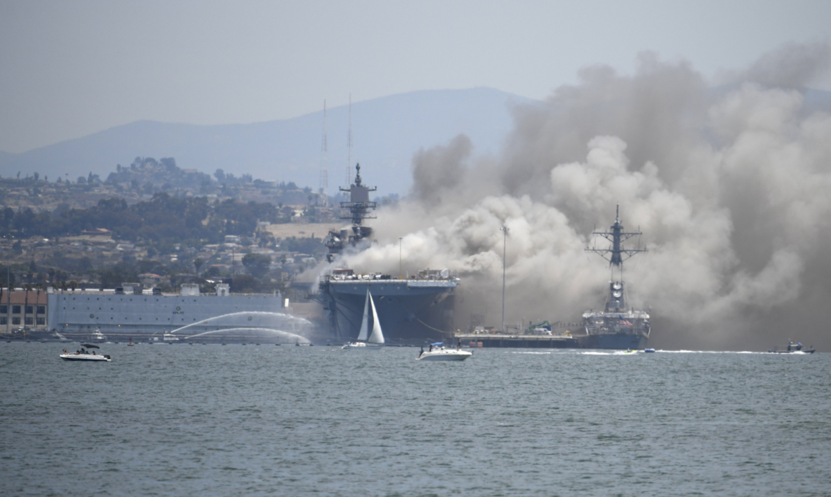 Smoke rises from the USS Bonhomme Richard