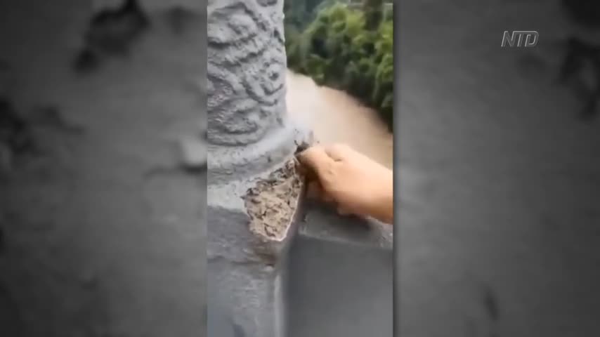 Bridge Guardrail Crumbles From Man's Touch