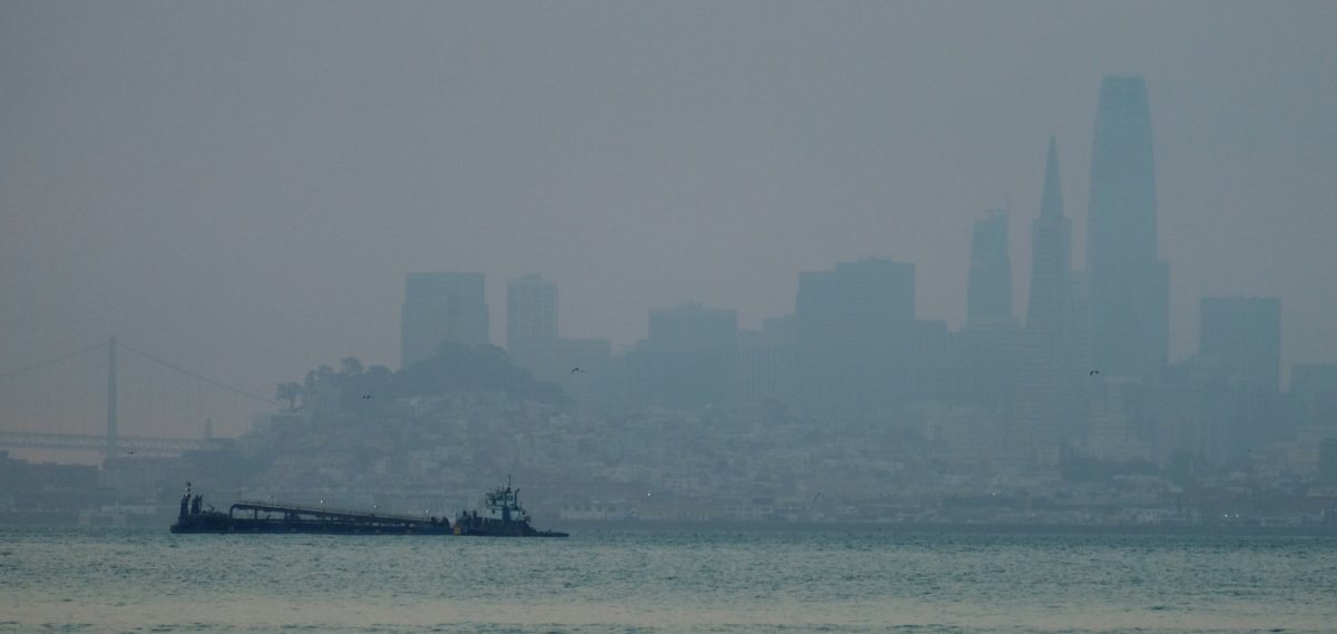 The San Francisco skyline is barely visible through smoke from wildfires Wed., Aug. 19, 2020, in this view from Sausalito, Calif. Thousands of people were under orders to evacuate in regions surrounding the San Francisco Bay Area Wednesday as nearly 40 wildfires blazed across the state amid a blistering heat wave now in its second week. Smoke blanketed the city of San Francisco. (Eric Risberg/AP Photo)