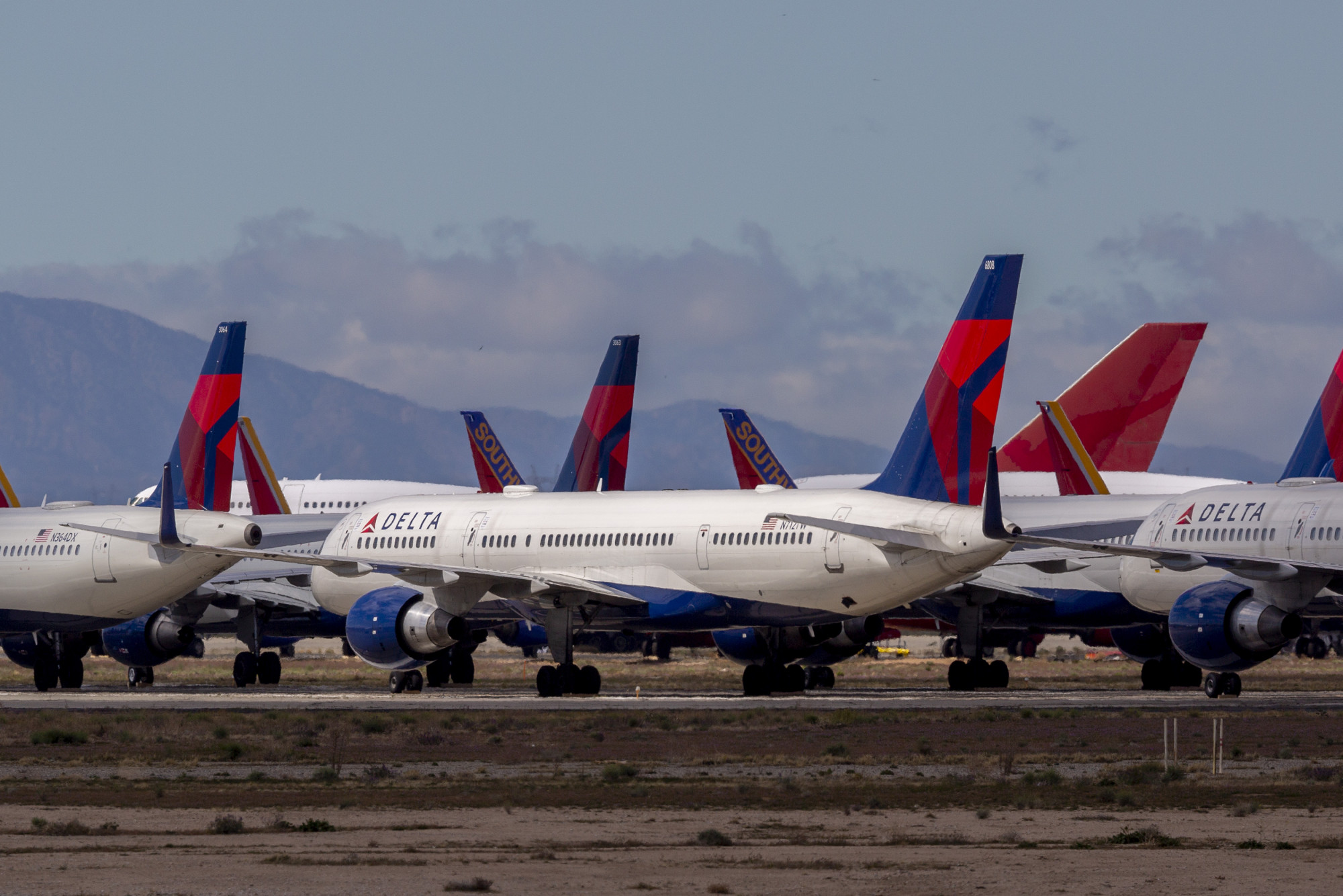 Passenger Arrested on Delta Flight After Cutting Himself and a Flight Attendant, Authorities Say