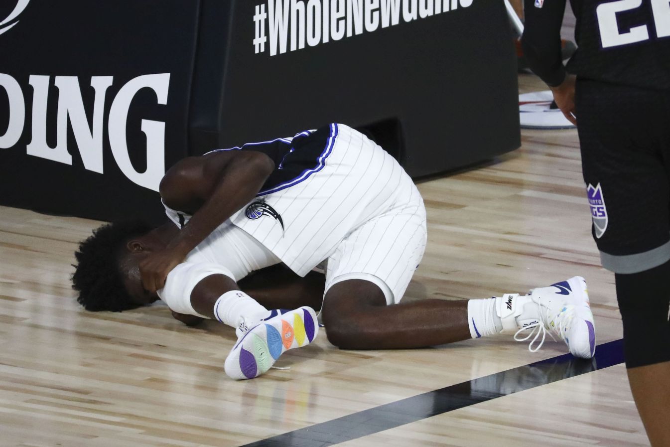 Jonathan Isaac #1 of the Orlando Magic reacts after an injury against the Sacramento Kings during an NBA game at the HP Field House arena in Osceola County, Fla., on Aug. 2, 2020. (Kim Klement-Pool/Getty Images)