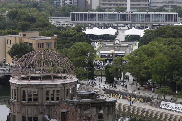 The Atomic Bomb Dome is seen in front of the venue holding a ceremony to mark the 75th anniversary of the atomic bombing at the Hiroshima Peace Memorial Park in Hiroshima, the 75th anniversary of the atomic bombing, western Japan on Aug. 6, 2020. (Kyodo/via Reuters)