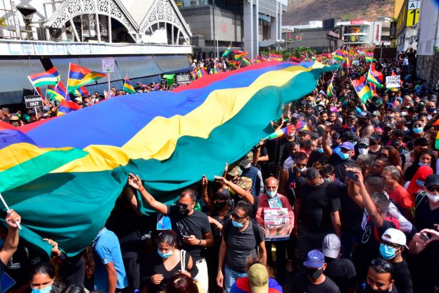 Tens of thousands of people protest in Port Louis, Mauritius, Sat., Aug. 29, 2020, over the government's slow response to an oil spill from a grounded Japanese ship and the alarming discovery of dozens of dead dolphins. (Beekash Roopun/L'express Maurice via AP)