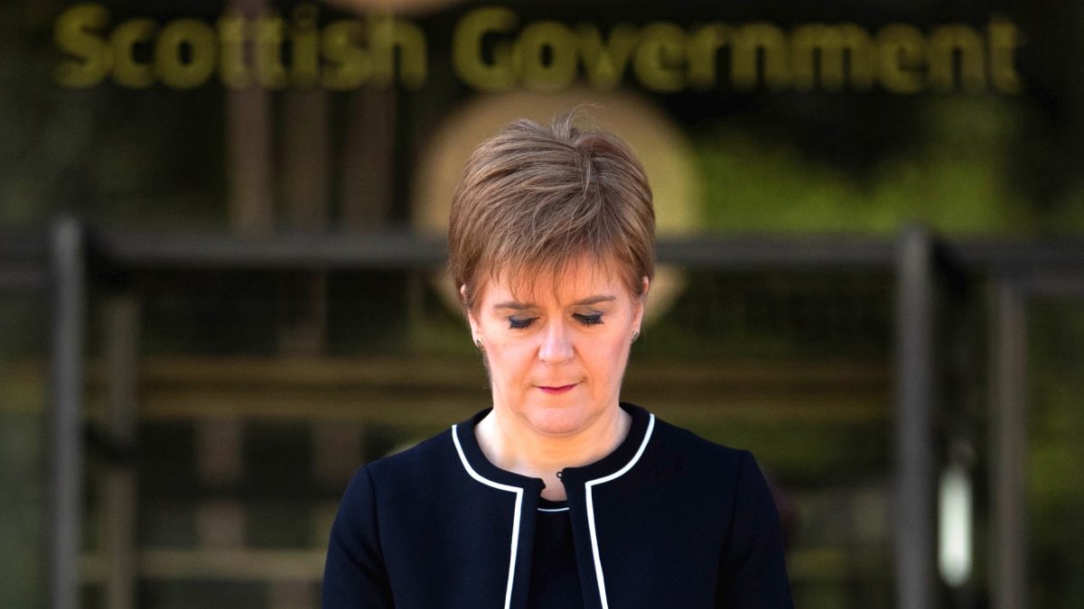 Scotland's First Minister Nicola Sturgeon observes a minute of silence in a tribute to the NHS staff and key workers who died during the coronavirus disease (COVID-19) outbreak, outside St Andrew's House in Edinburgh, on Apr. 28. 2020. (Jane Barlow/Pool via Reuters)