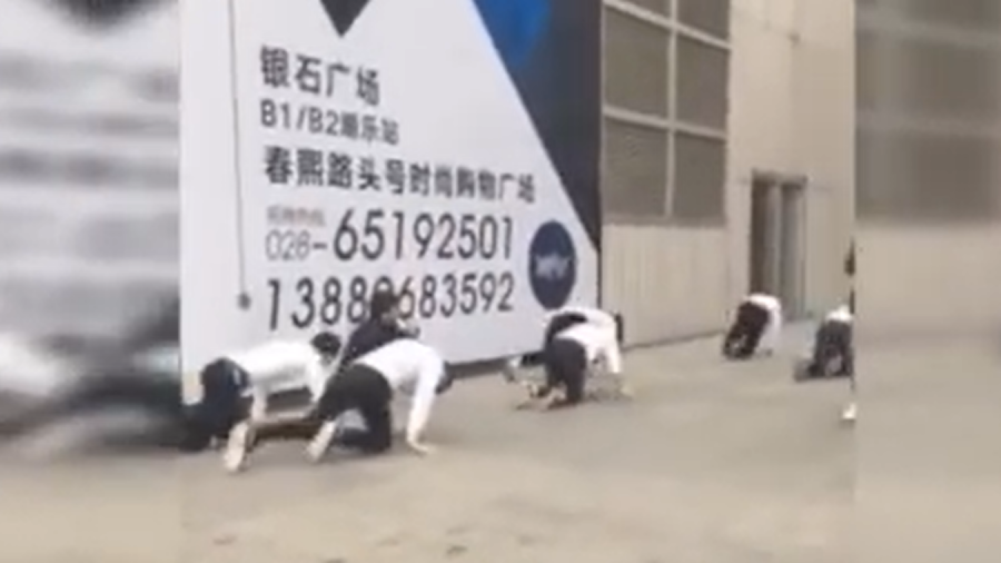 Employees Crawl in Public as Punishment