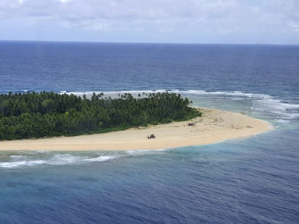 An Australian Army helicopter lands on Pikelot Island in the Federated States of Micronesia where three men were found, safe and healthy after missing for three days, on Aug. 2, 2020. (Australian Defence Force via AP)