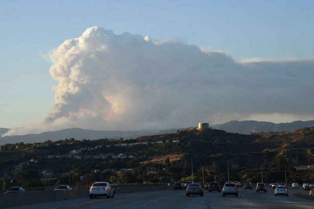 The plume of smoke from the Lake Fire in Angeles National Forest, by Lake Hughes, 60 miles north of Los Angeles, is seen from the 14 freeway in Agua Dulce, Calif., on Aug. 12, 2020. (Robyn Beck/AFP via Getty Images)
