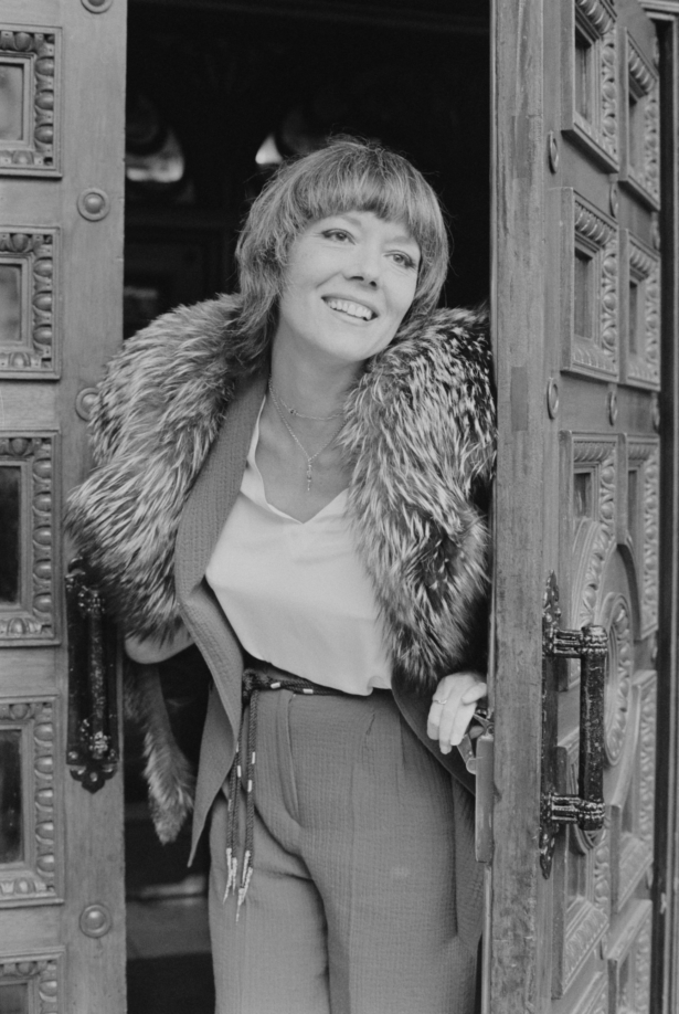 British actress Diana Rigg opening a door, in U.K., on March 19, 1969. (Evening Standard/Hulton Archive/Getty Images)
