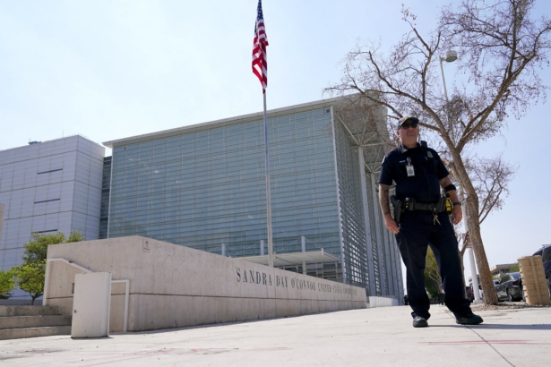 A Phoenix Police officer stands in front of the Sandra Day O'Connor U.S. Courthouse in Phoenix on Sept. 15, 2020. (Ross D. Franklin/AP Photo)