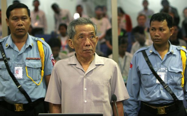 Former Khmer Rouge S-21 prison chief Kaing Guek Eav, better known as Duch, stands in a courtroom during a pre-trial in Phnom Penh on Dec. 5, 2008. (Tang Chhinsothy/Pool Cambodia/Reuters)