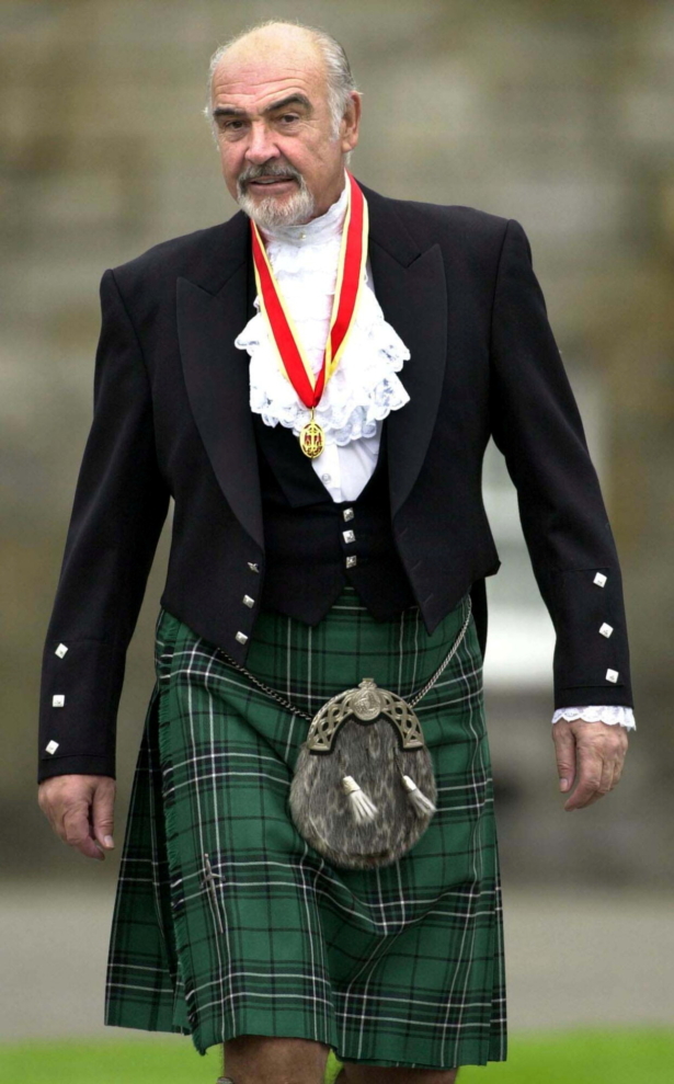 Sir Sean Connery wearing full highland dress walks towards waiting journalists after he was formally knighted by Britain's Queen Elizabeth at Holyrood Palace in Edinburgh on July 5, 2020. (File Photo via Reuters)