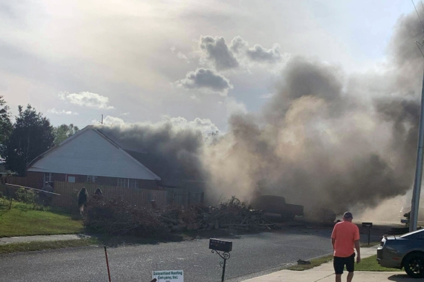 This photo provided by Greg Crippen shows the scene where a U.S. Navy training plane crashed in an Alabama residential neighborhood near the Gulf Coast on Oct. 23, 2020 near Foley, Ala. (Greg Crippen via AP)fs