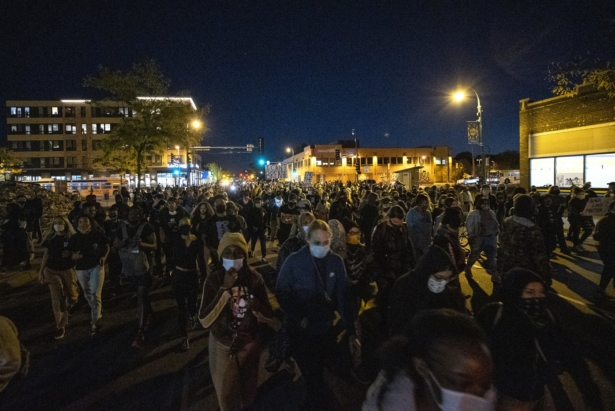 Demonstrators block an intersection in Minneapolis on Oct. 7, 2020, after Derek Chauvin, the former Minneapolis police officer charged with murder in the death of George Floyd, posted bail and was released from prison. (Carlos Gonzalez/Star Tribune via AP)
