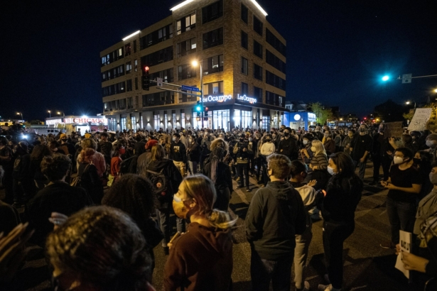 Demonstrators block an intersection in Minneapolis on Oct. 7, 2020, after Derek Chauvin, the former Minneapolis police officer charged with murder in the death of George Floyd, posted bail and was released from prison. (Carlos Gonzalez/Star Tribune via AP)