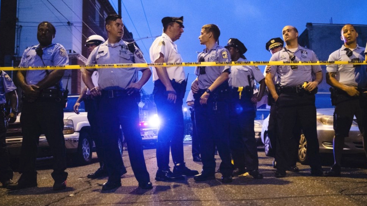 Officers are seen gathered in a file photo after an investigate into a shooting in Pennsylvania. (Matt Rourke/File Photo via AP)