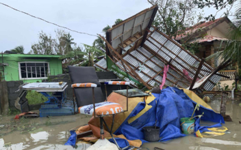 Typhoon Leaves 13 Missing, Displaces Thousands in Philippines