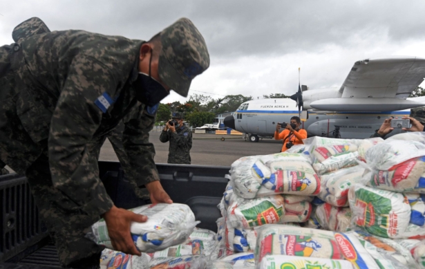 Honduran Air Force members load supplies on planes, to be taken to residents of Puerto Lempira municipality, department of Gracias a Dios, in preparation for the arrival of the upcoming Hurricane Eta, in Tegucigalpa, on Nov. 2, 2020. (Orlando Sierra/AFP via Getty Images)